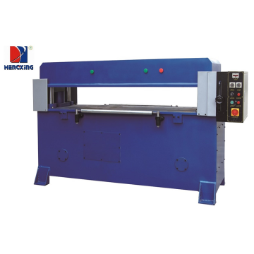 Auto-feeding hydraulic press cutting machine for clamshell